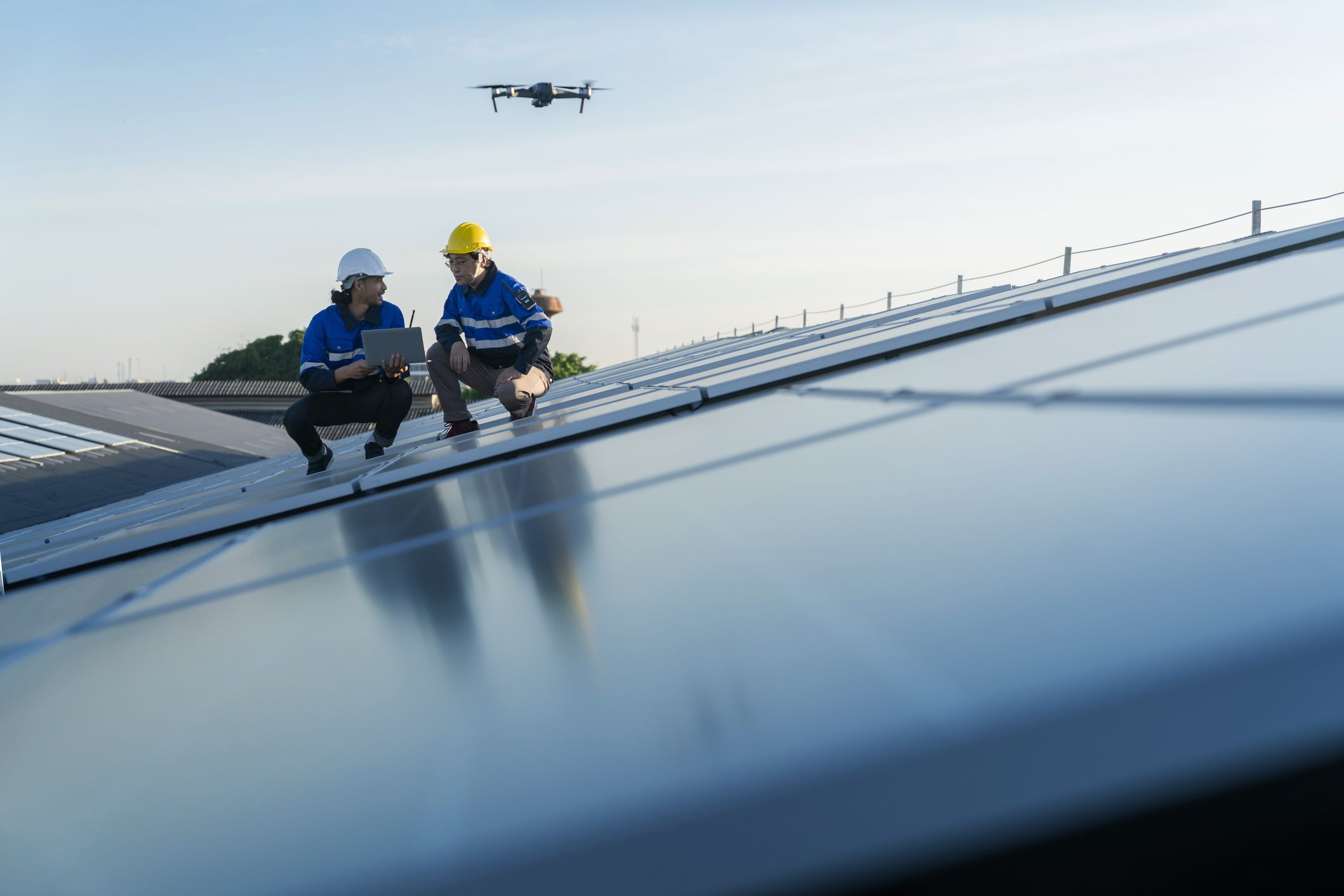 Professionals inspecting a roof